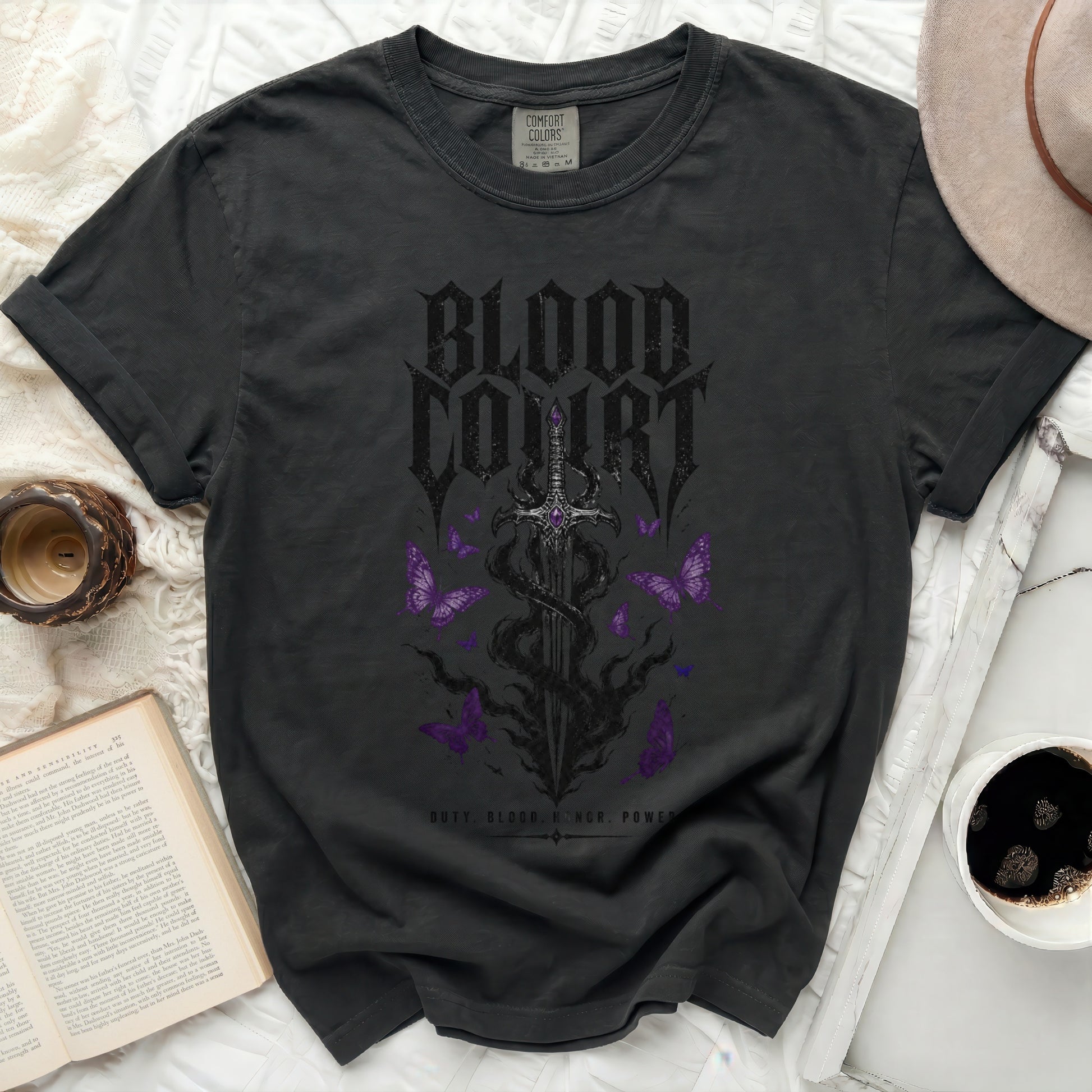 Dark grey t-shirt with "BLOOD COURT" text, sword, and butterflies.