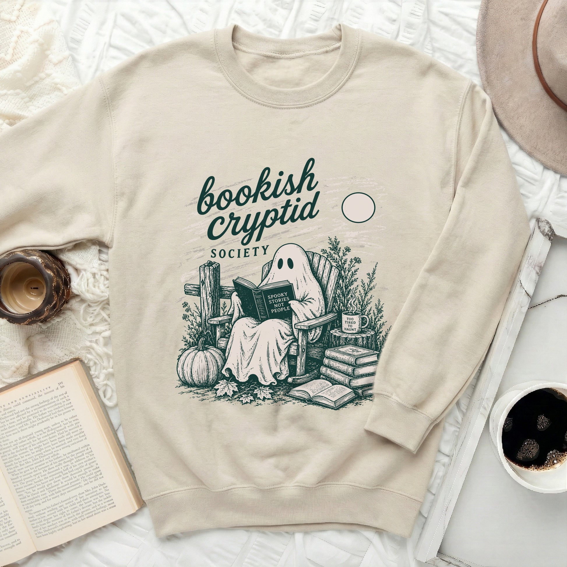 Crewneck sweatshirt with a ghost reading a book titled "Spooky Stories Not People".