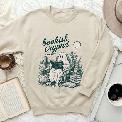 Crewneck sweatshirt with a ghost reading a book titled "Spooky Stories Not People".