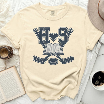 Cream t-shirt with "H S" and crossed hockey sticks over an open book.
