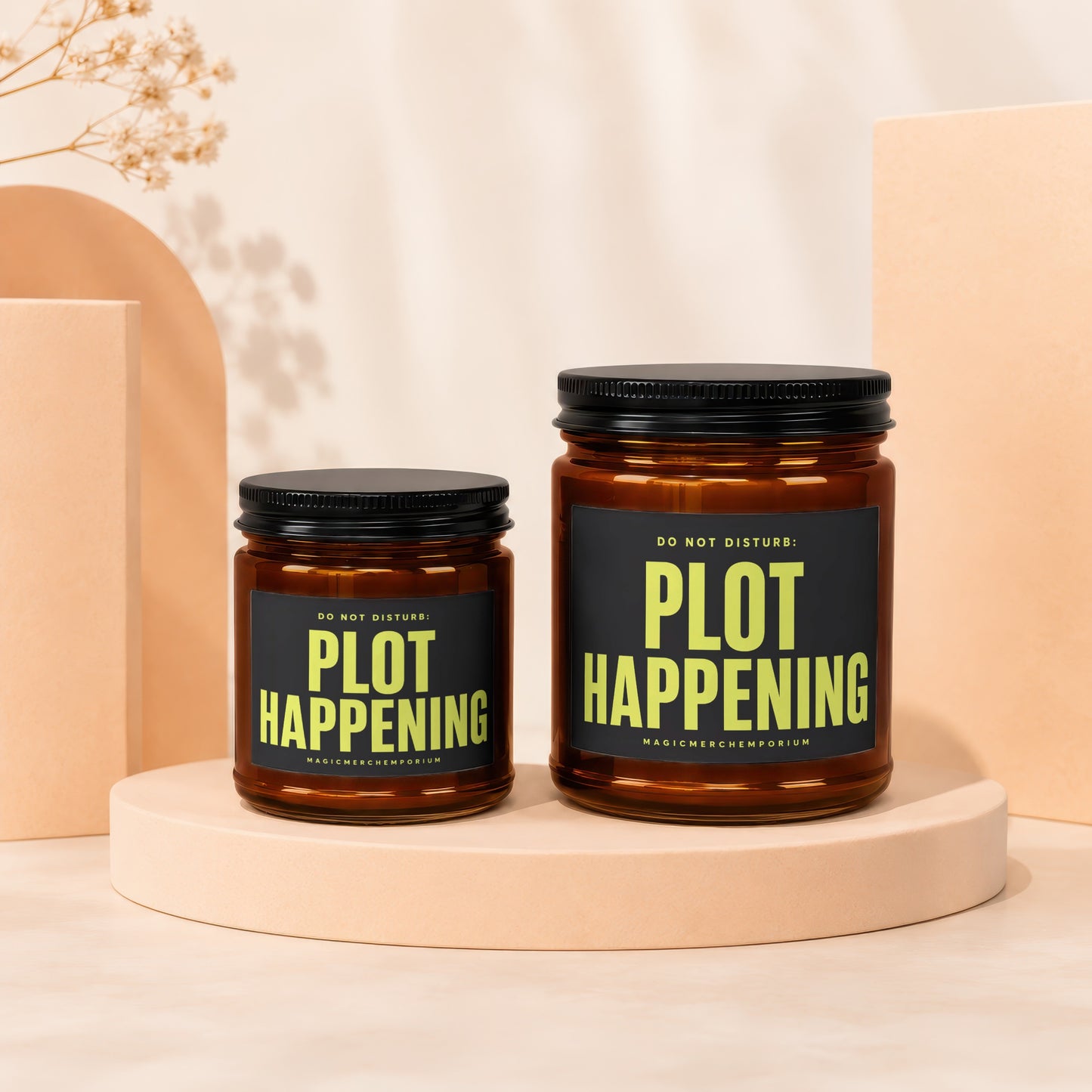 Two amber glass candles with black lids and labels reading "DO NOT DISTURB: PLOT HAPPENING".