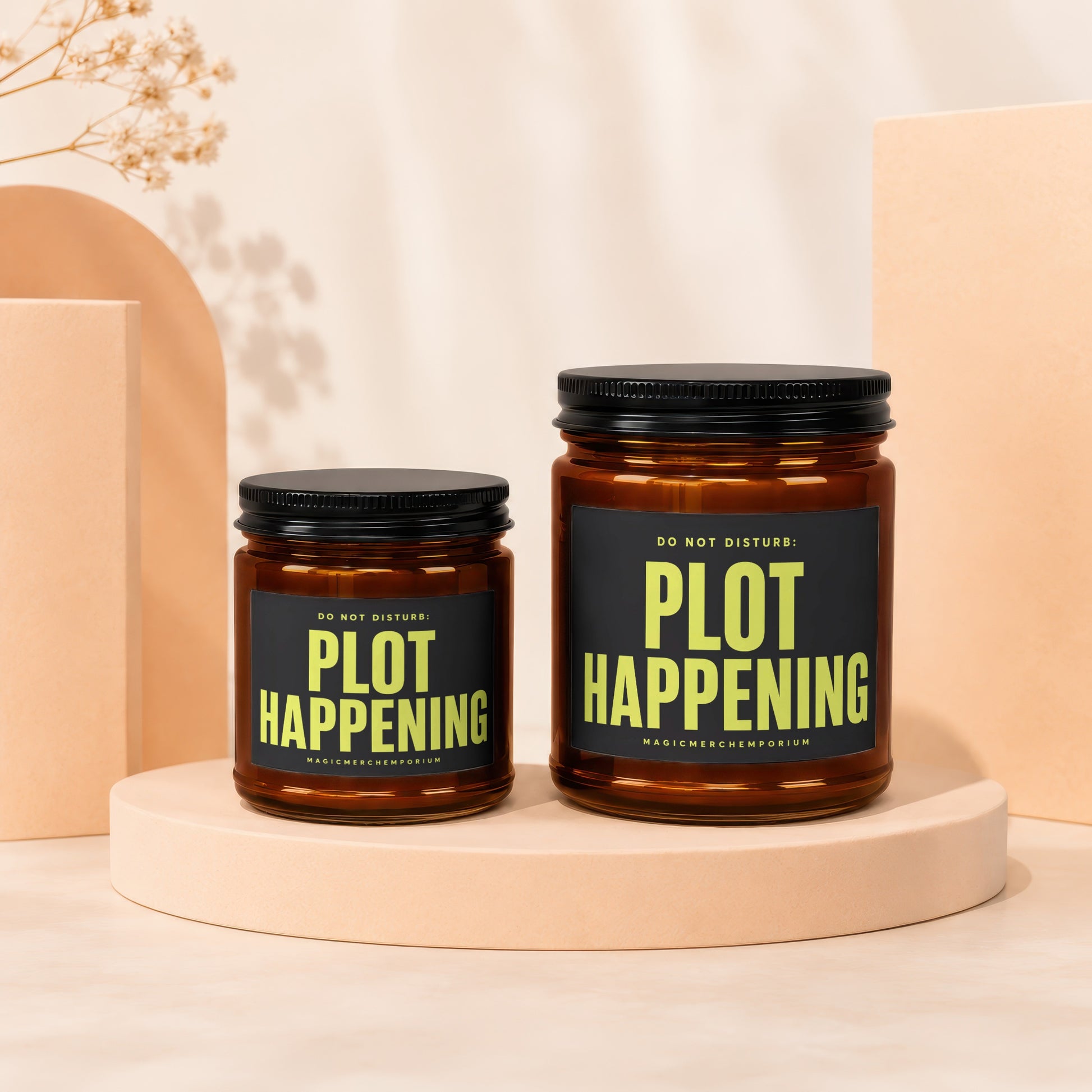 Two amber glass candles with black lids and labels reading "DO NOT DISTURB: PLOT HAPPENING".
