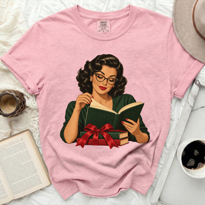 Pink t-shirt with Comfort Colors tag featuring retro illustration of woman reading a book.