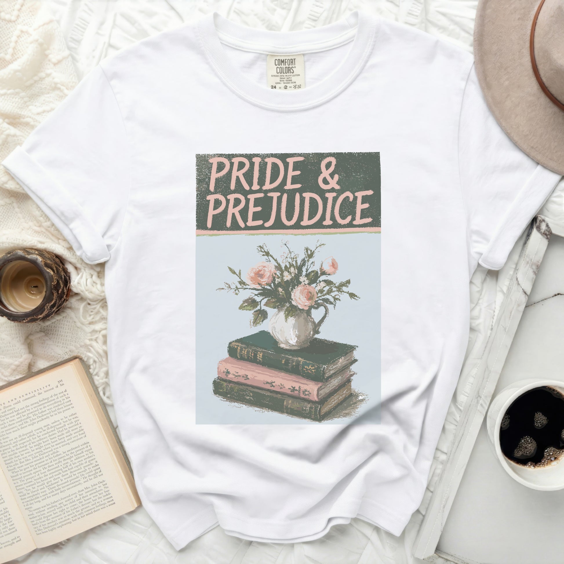 White t-shirt with "Pride & Prejudice" and flowers on books graphic.