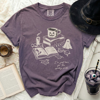 T-shirt with Halloween-themed illustration and text "I'm just here for the spooky plots."