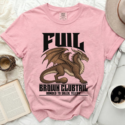 Pink t-shirt with black text "FUIL" and a brown dragon graphic.