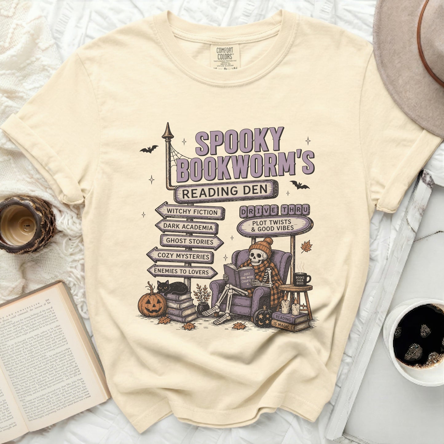 T-shirt with "Spooky Bookworm's Reading Den" and genre signposts.