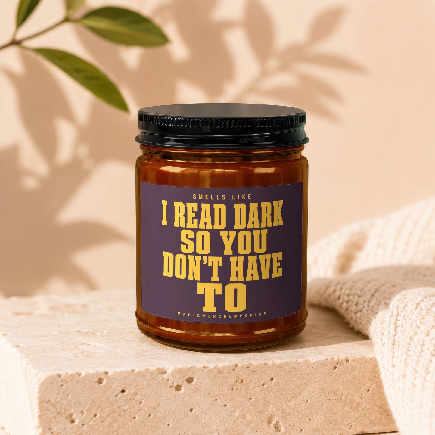 Candle labeled "Smells Like I Read Dark So You Don't Have To"