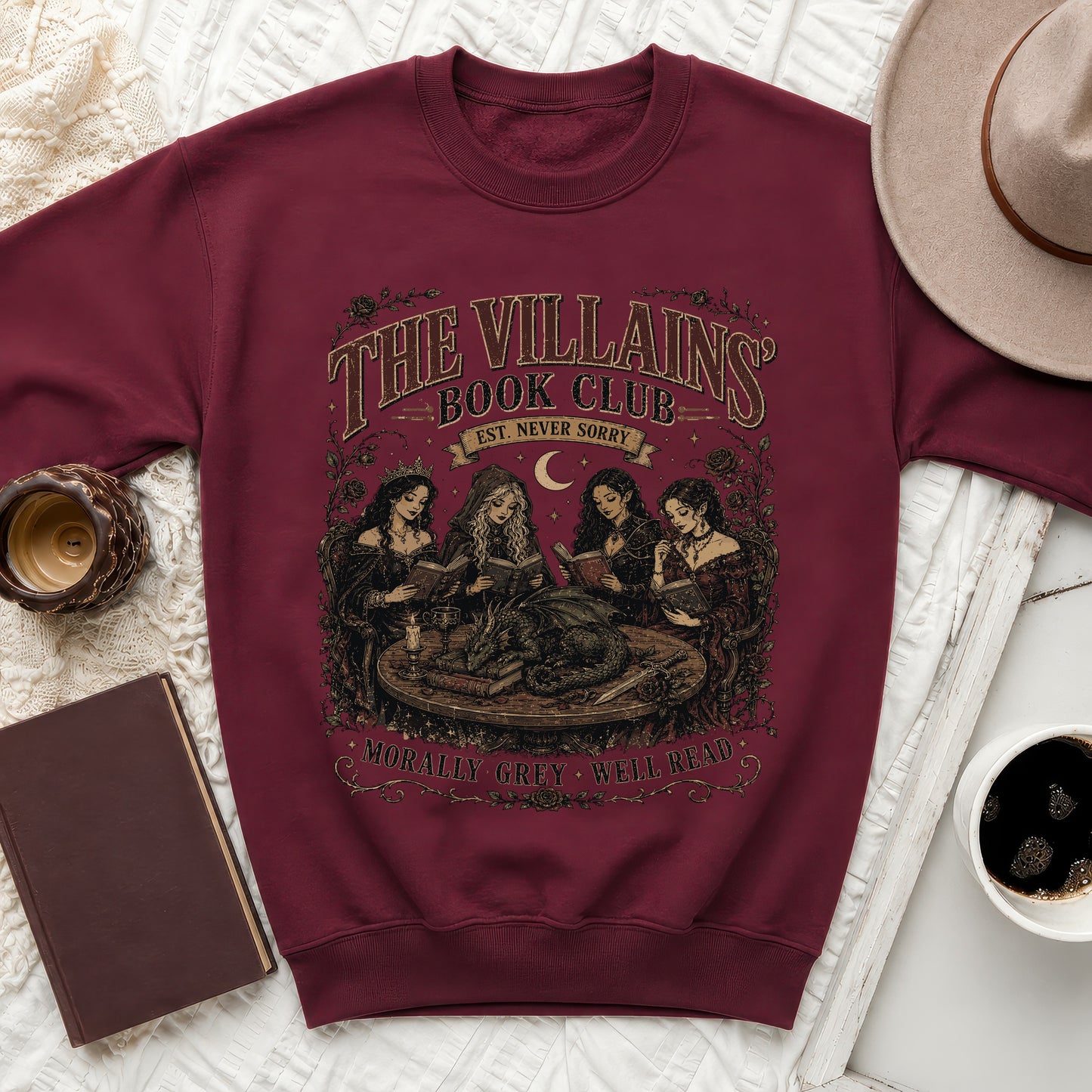 Maroon sweatshirt with "The Villains Book Club" graphic and dragon scene.
