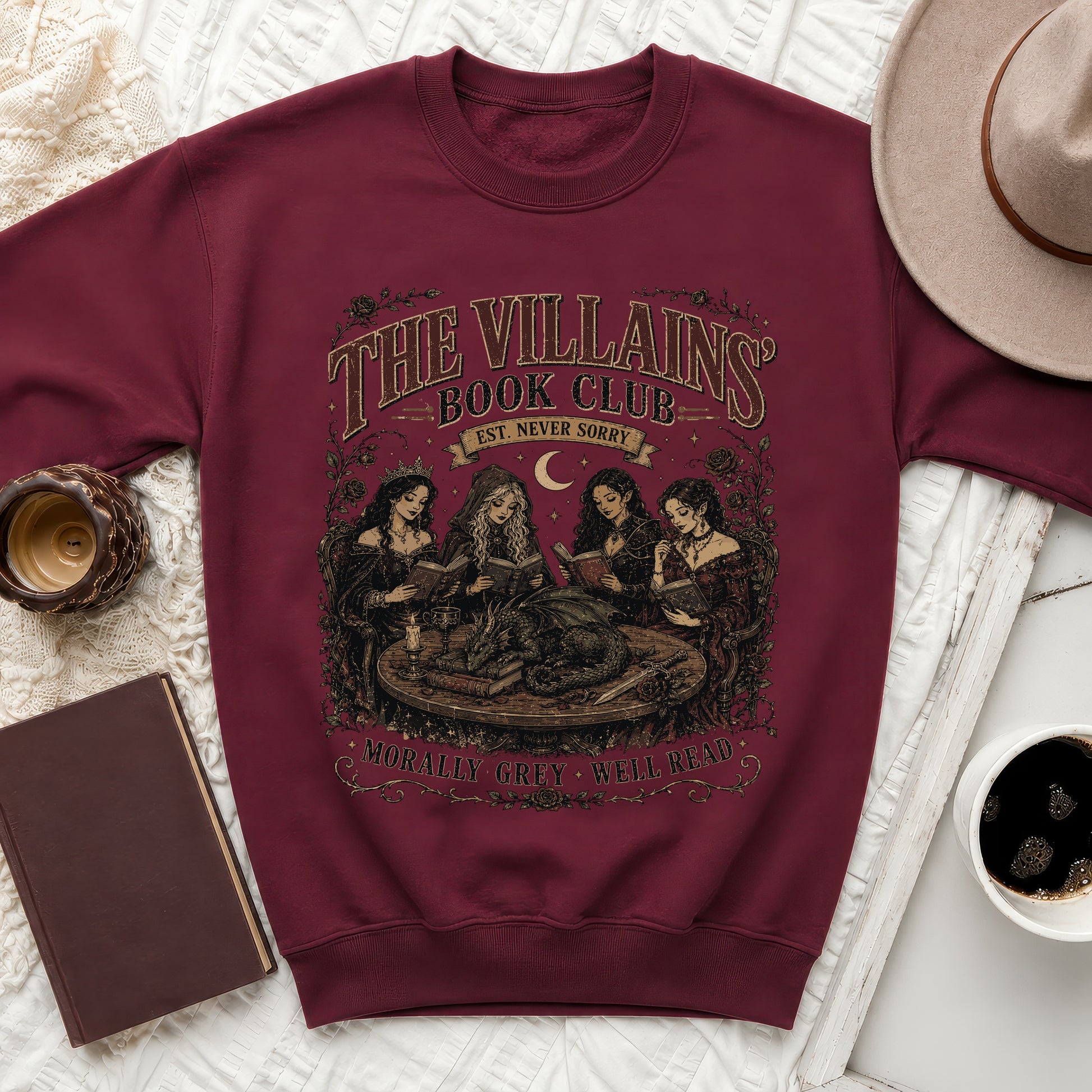 Maroon sweatshirt with "The Villains Book Club" graphic and dragon scene.