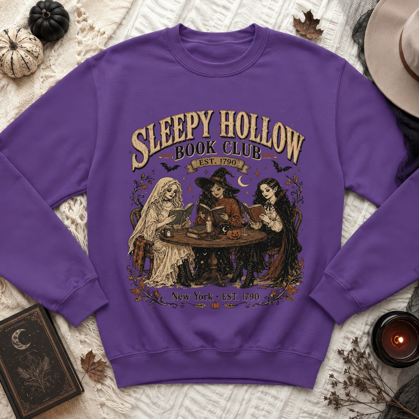 Purple sweatshirt with Sleepy Hollow Book Club art and vintage figures.