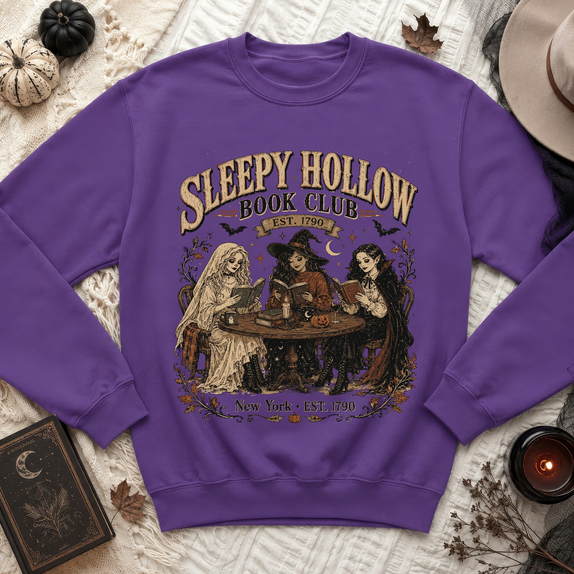 Purple sweatshirt with Sleepy Hollow Book Club art and vintage figures.