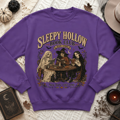 Purple sweatshirt with Sleepy Hollow Book Club art and vintage figures.