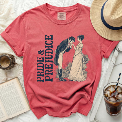 Coral t-shirt with "Pride & Prejudice" text and illustration of a couple.