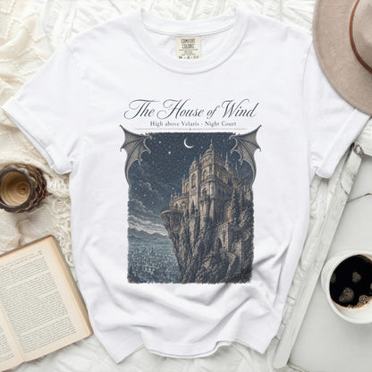 White t-shirt with "The House of Wind" art: castle, night sky.