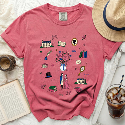 Pink t-shirt with scattered pattern of historical illustrations and a Comfort Colors tag.