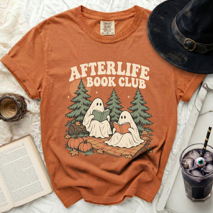 Orange t-shirt with "Afterlife Book Club" graphic of ghosts reading books.