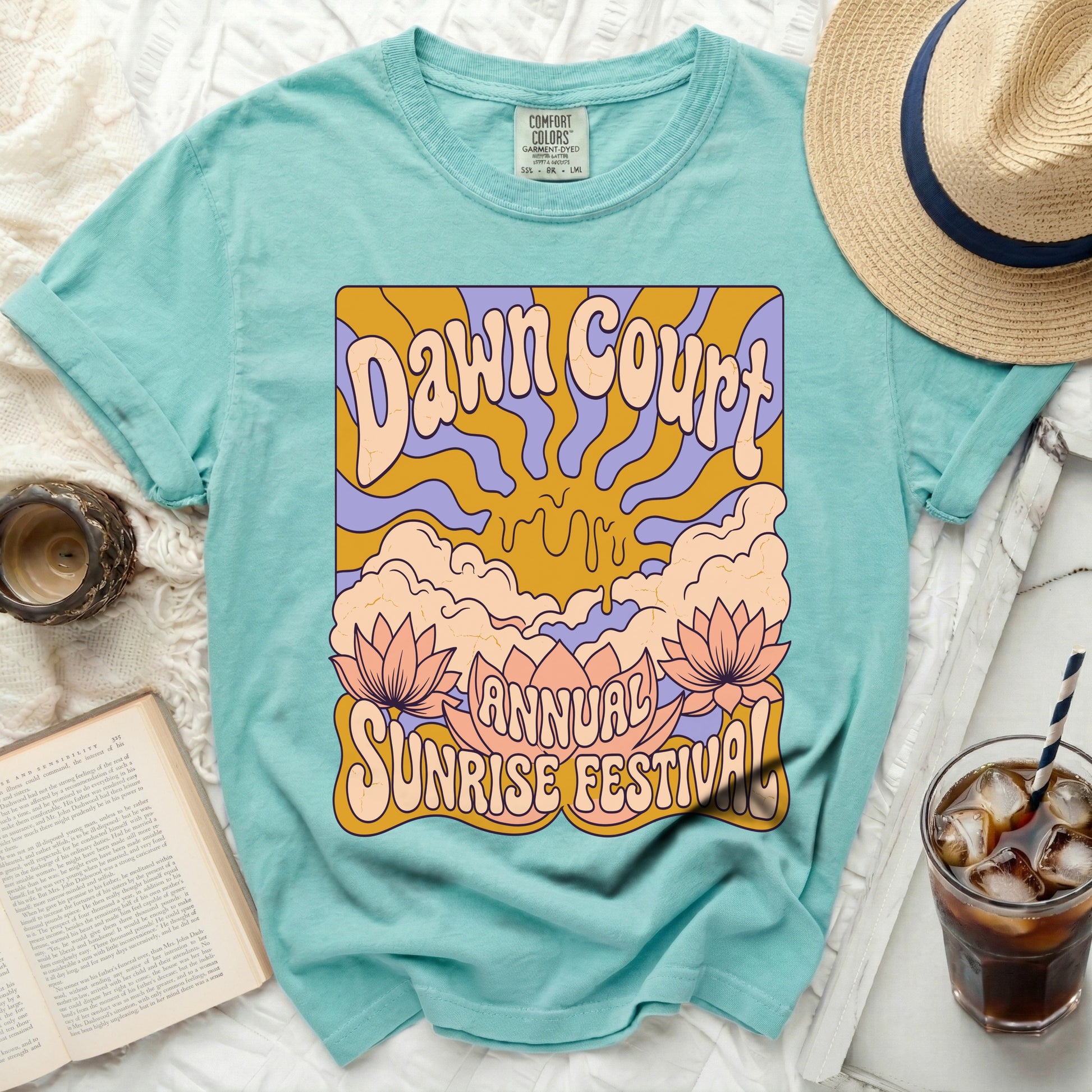 Aqua t-shirt with "Dawn Court Annual Sunrise Festival" graphic.