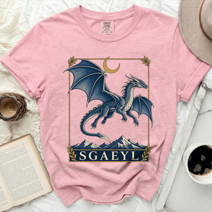 Pink Comfort Colors t-shirt with a blue dragon design and "SGAEYL" text.