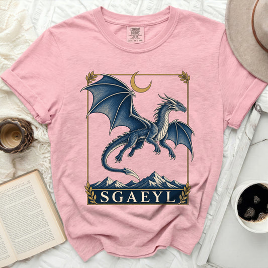 Pink Comfort Colors t-shirt with a blue dragon design and "SGAEYL" text.