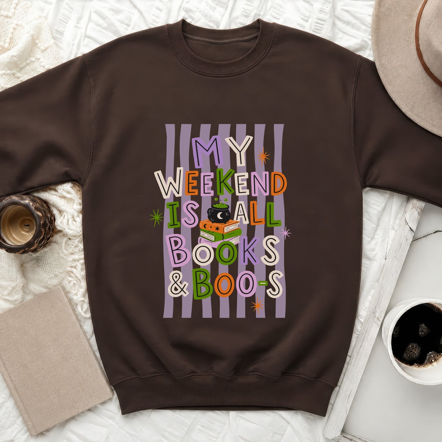 Brown sweatshirt with a Halloween-themed graphic: "My weekend is all books & boos".