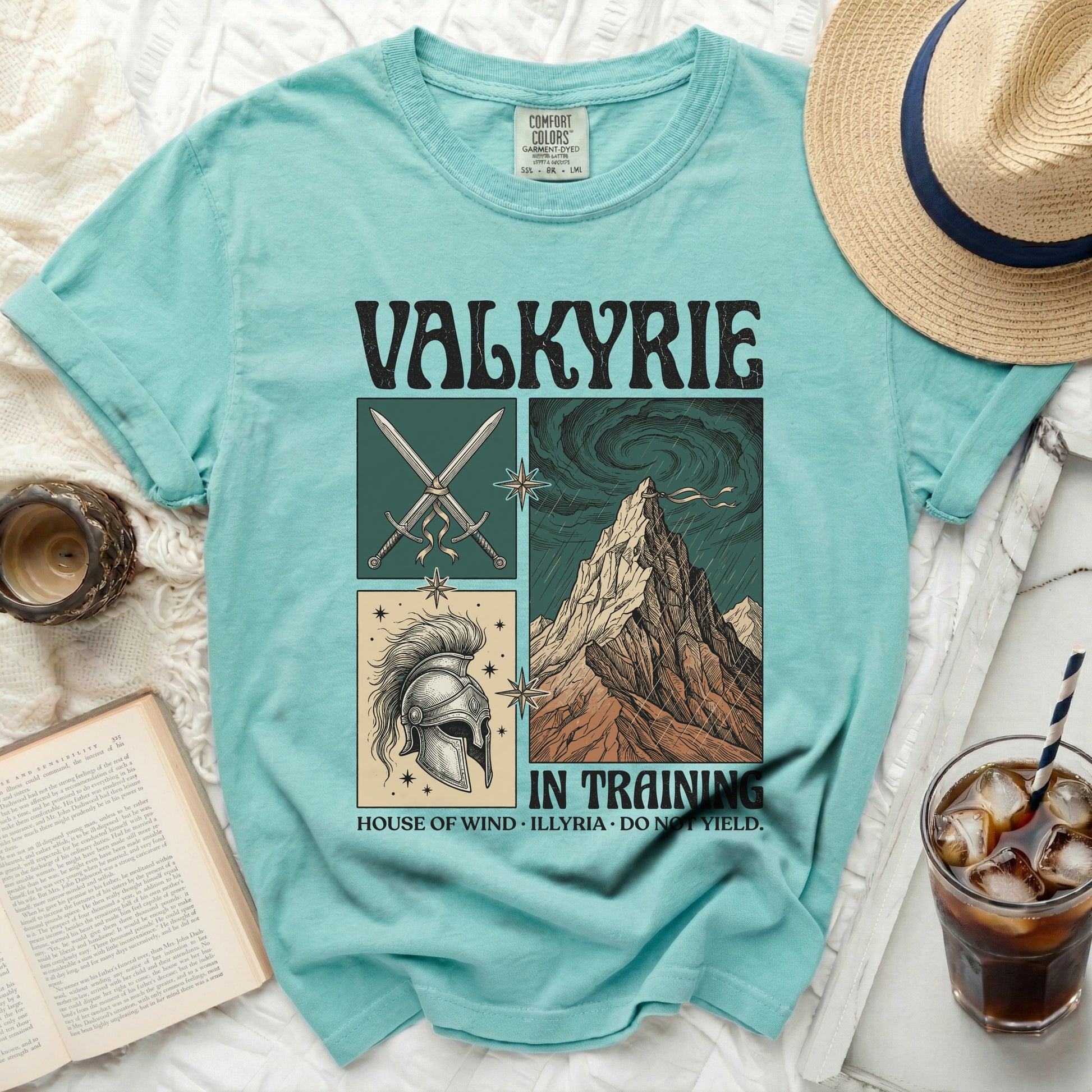Turquoise t-shirt with "Valkyrie" text and graphic panels.
