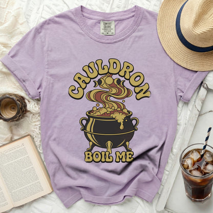 Lavender t-shirt with "Cauldron Boil Me" graphic and a cauldron.