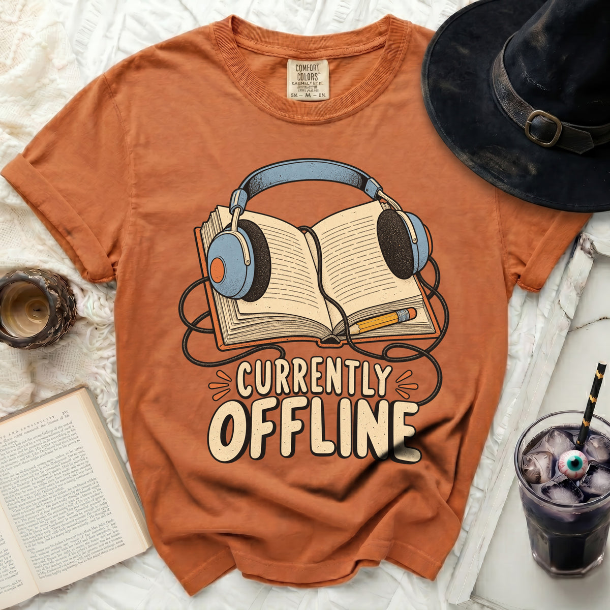 Orange t-shirt with "Currently Offline" text and headphones over an open book graphic.