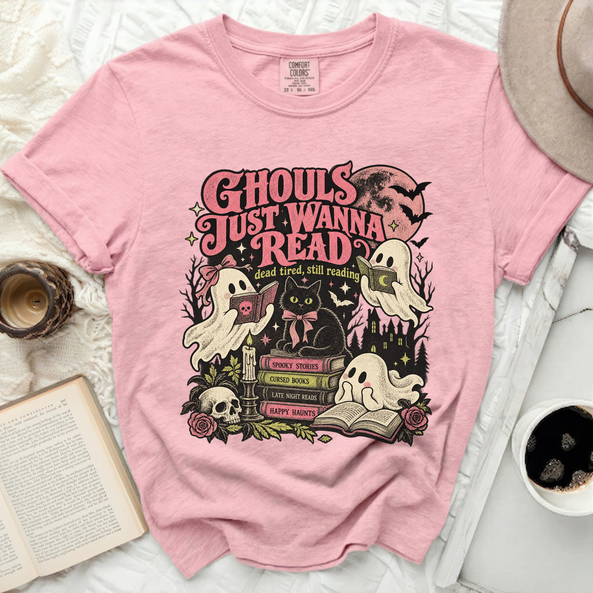 Pink t-shirt with "Ghouls Just Wanna Read" Halloween graphic.
