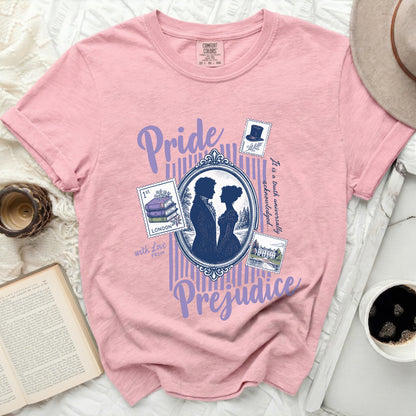 Pink t-shirt with "Pride and Prejudice" graphic and postage stamps.