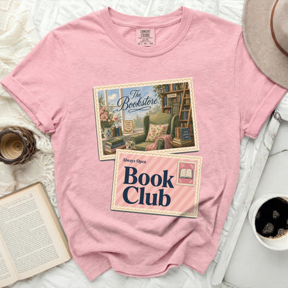 Pink t-shirt with "The Bookstore" and "Always Open Book Club" graphic.