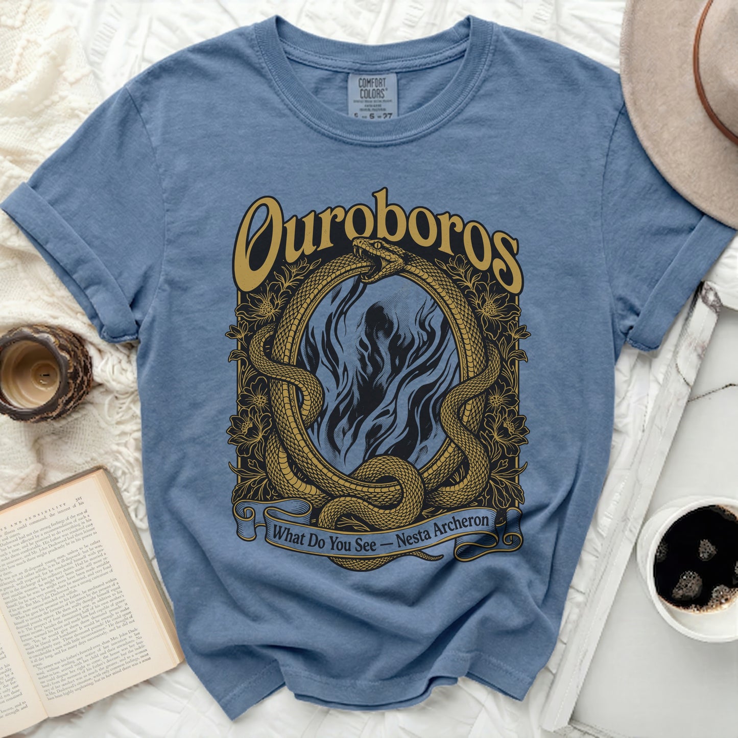 Blue t-shirt with ouroboros snakes, flames, and "What Do You See - Nesta Archeron" text.