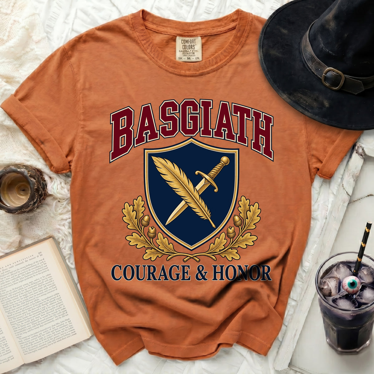 Orange t-shirt with "BASGIATH" and "COURAGE & HONOR" text and a shield emblem.