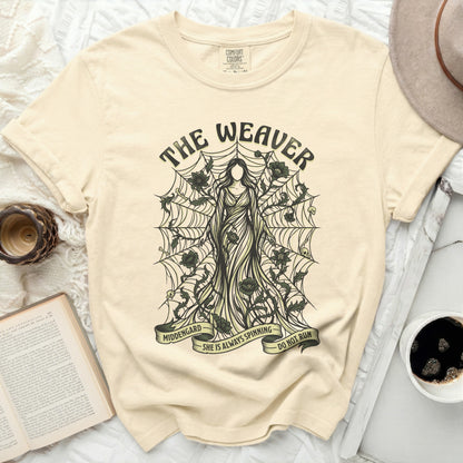 The Weaver t-shirt features a skeletal figure on a spiderweb with text reading "MIDDENGARD SHE IS ALWAYS SPINNING DO NOT RUN".