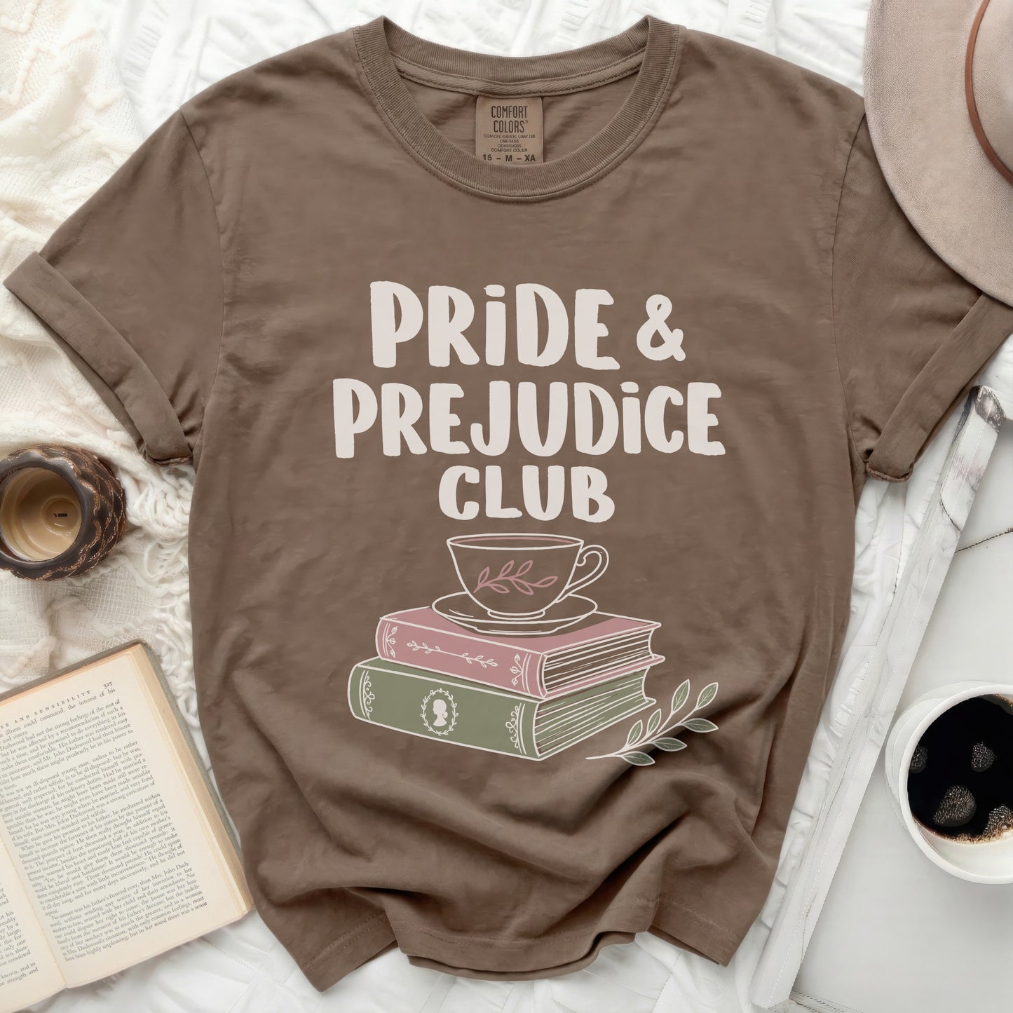 Brown shirt with "Pride & Prejudice Club" text and stack of books graphic.