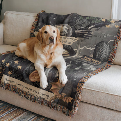 A golden retriever dog is lying on a couch with a dragon-themed blanket.