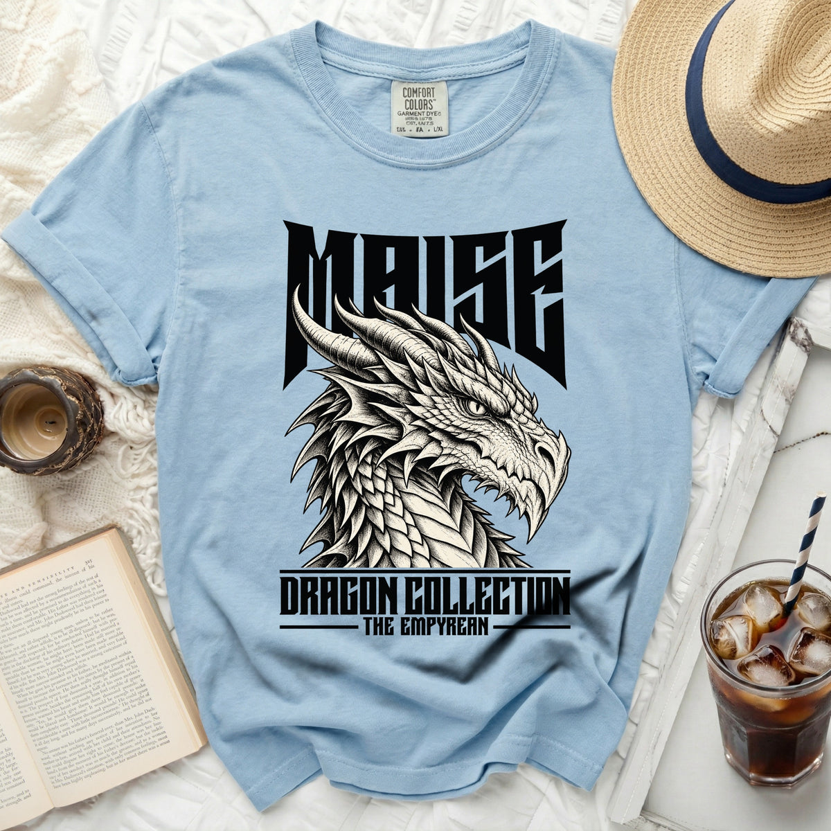 Light blue t-shirt with "MAISE Dragon Collection The Empyrean" text and dragon graphic.
