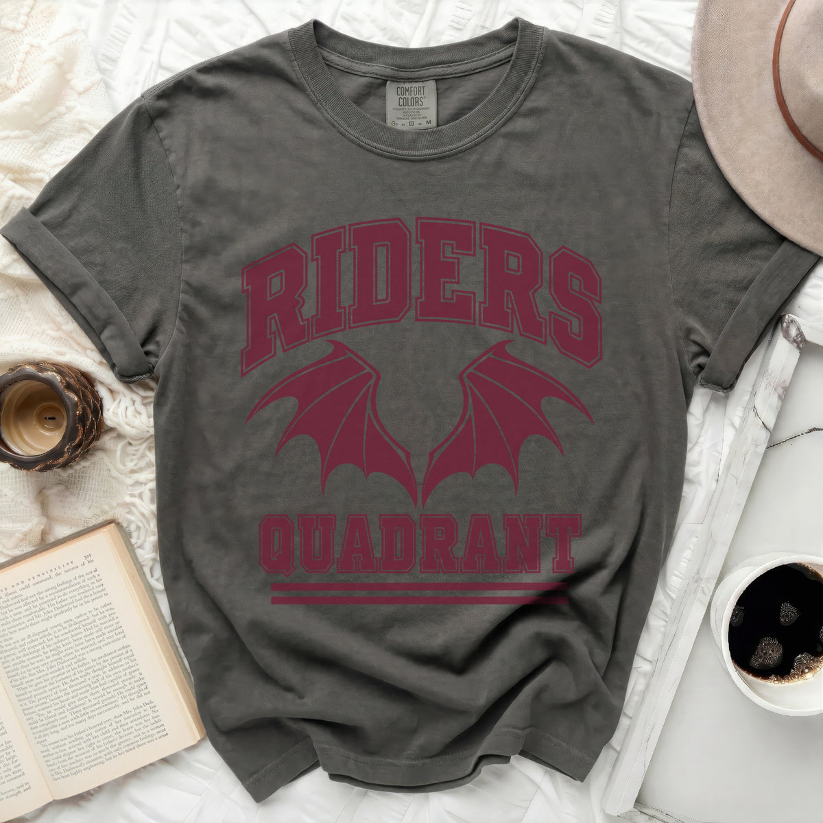 Dark grey t-shirt with burgundy "RIDERS QUADRANT" text and dragon wings.