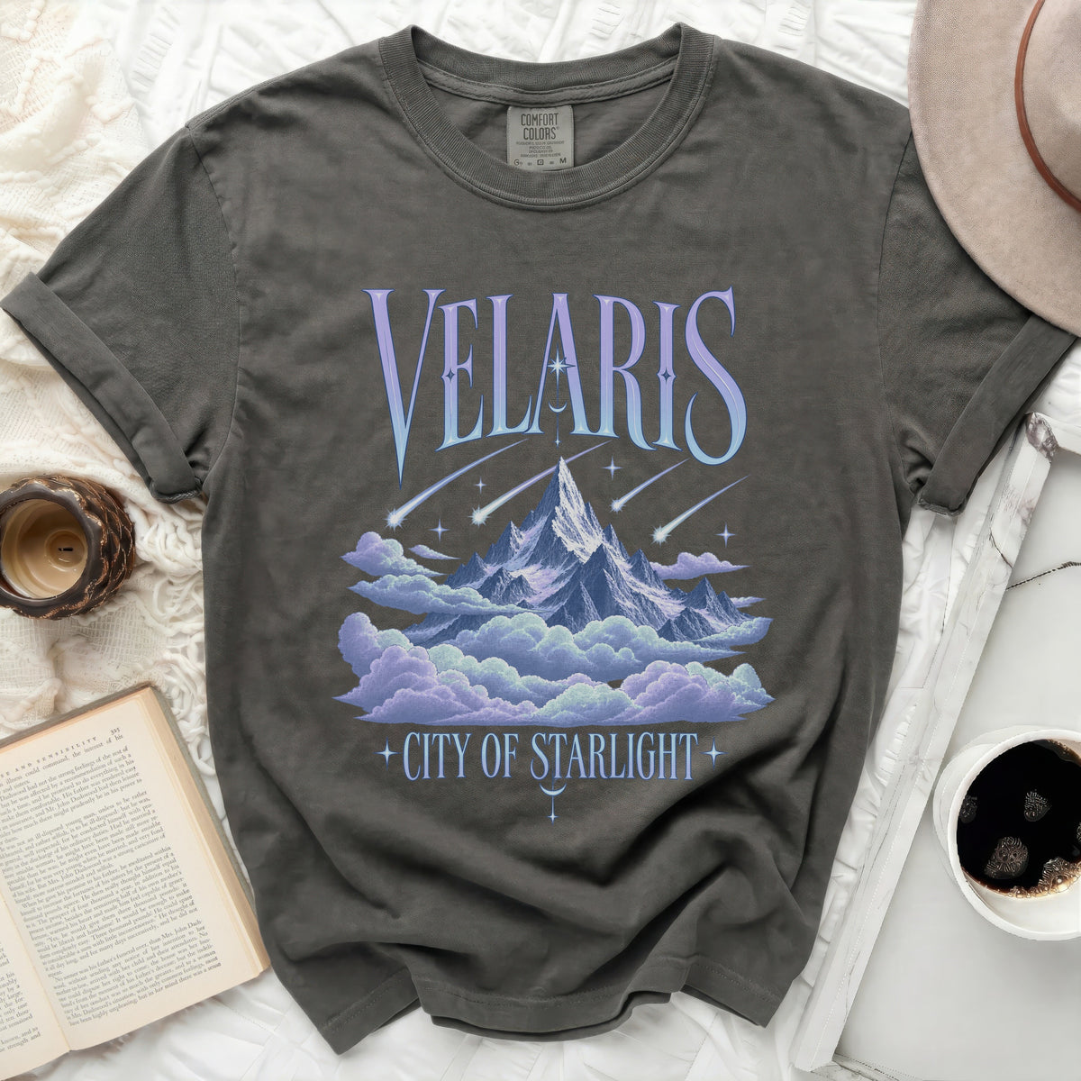 T-shirt with "Velaris City of Starlight" text and a mountain and cloud graphic.