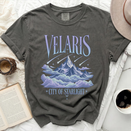T-shirt with "Velaris City of Starlight" text and a mountain and cloud graphic.