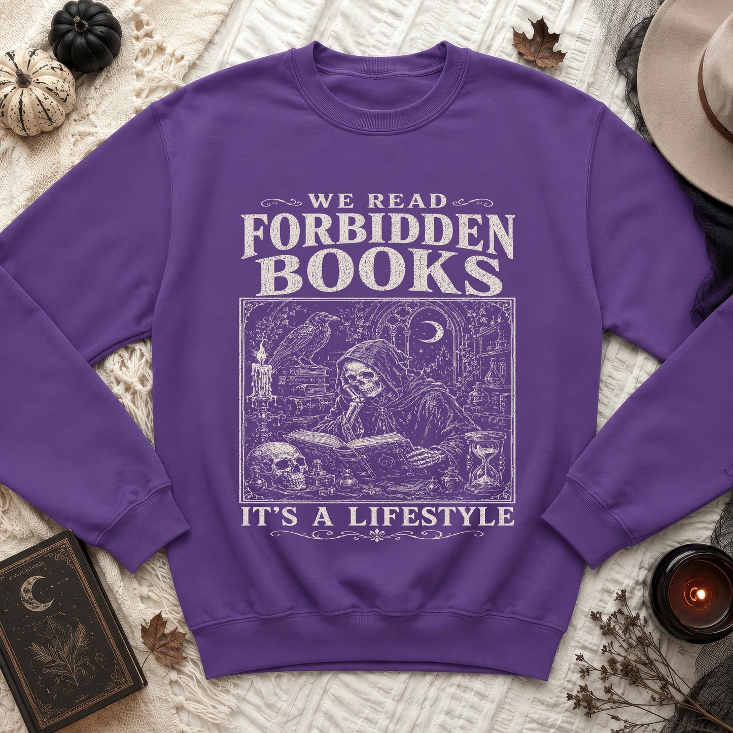 Purple sweatshirt with "We Read Forbidden Books" text and gothic illustration.