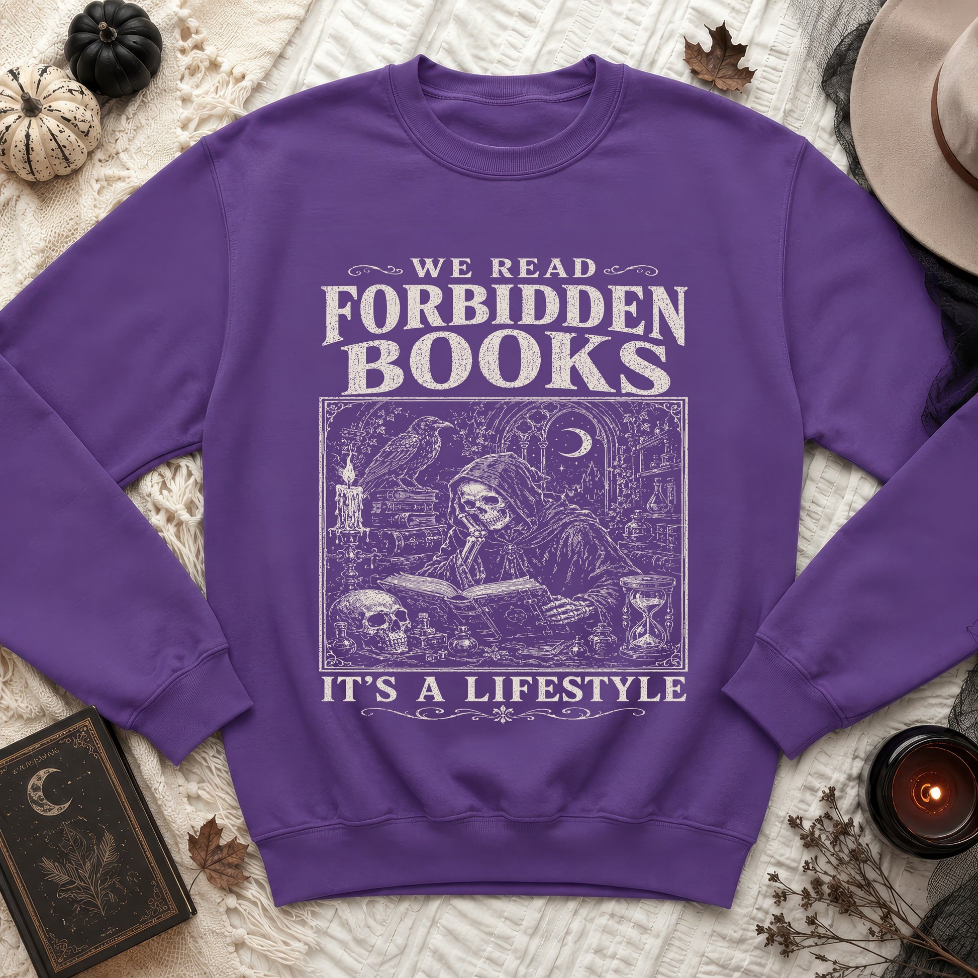 Purple sweatshirt with "We Read Forbidden Books" text and gothic illustration.
