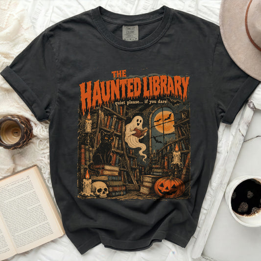 Dark t-shirt with "The Haunted Library" Halloween graphic.