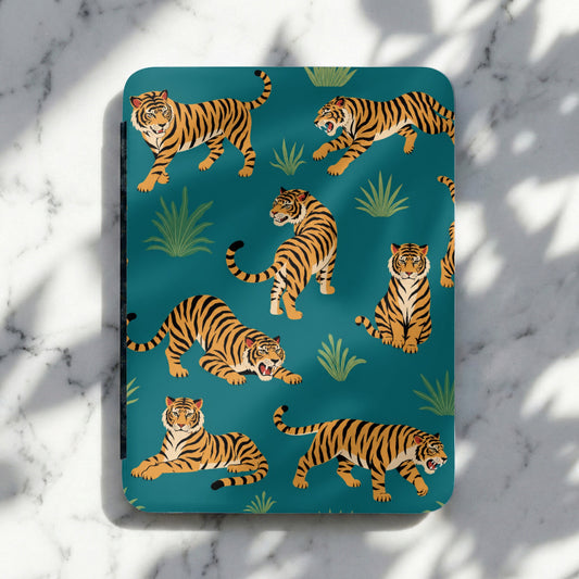 Territorial tigers on a teal background with lush greenery and shadows.