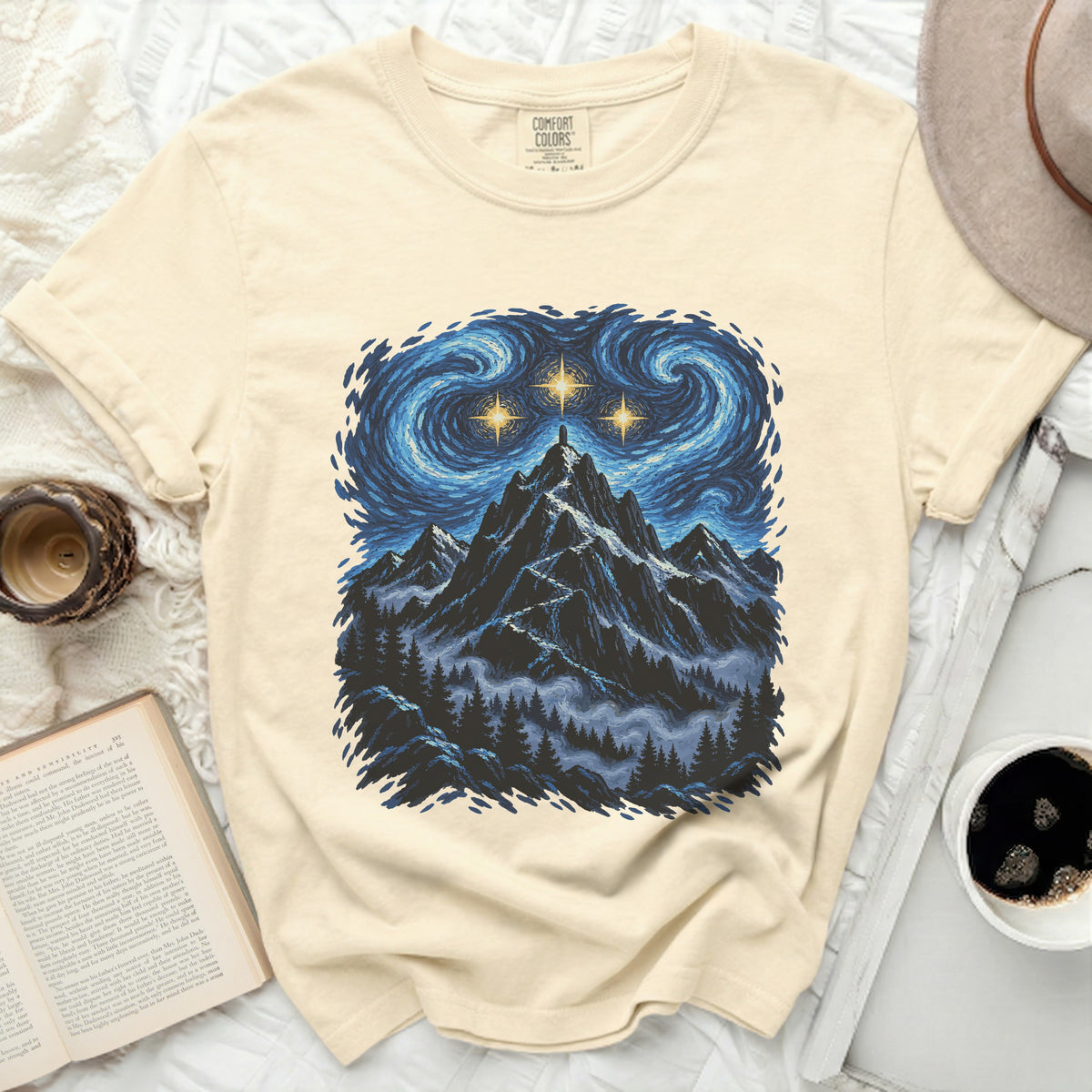 Cream t-shirt with a mountain and starry sky graphic, Comfort Colors label.