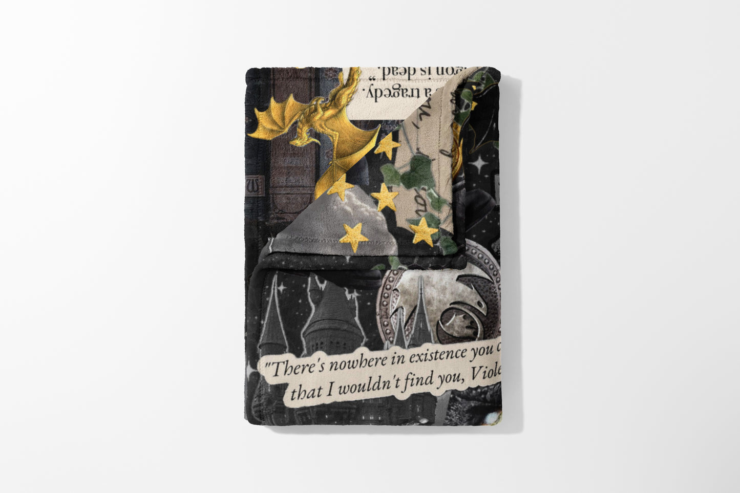 Collaged throw with gold dragon, stars, castles, and text quote "There's nowhere in existence you c".
