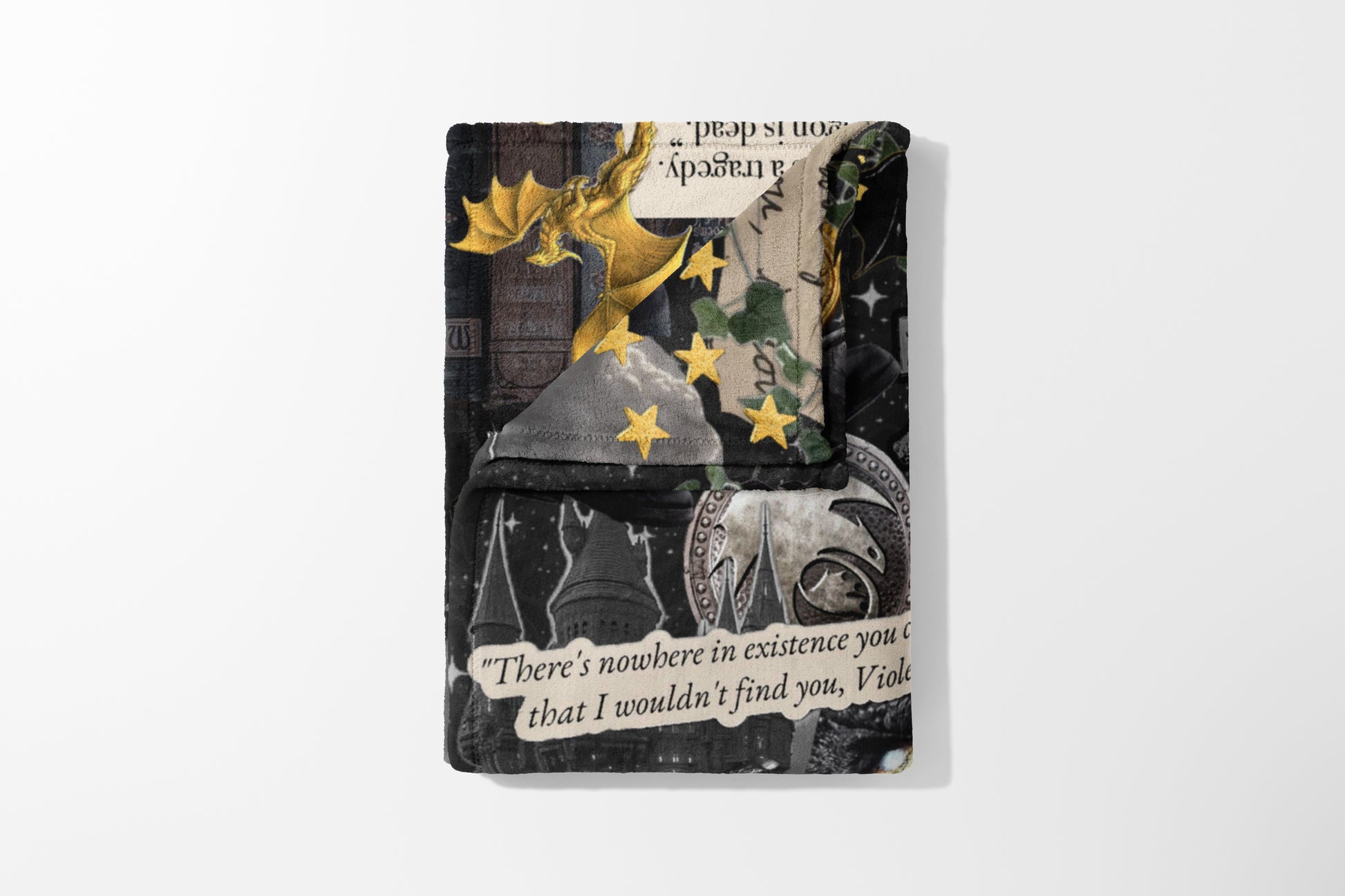 Collaged throw with gold dragon, stars, castles, and text quote "There's nowhere in existence you c".