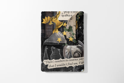 Collaged throw with gold dragon, stars, castles, and text quote "There's nowhere in existence you c".
