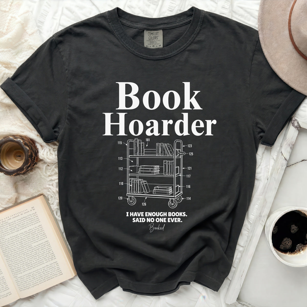 Dark t-shirt with "Book Hoarder" text and bookshelf illustration.