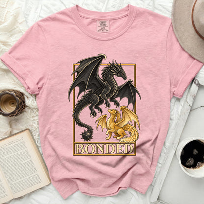 Pink t-shirt featuring black and gold dragons and the word BONDED.